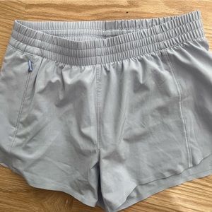 Athleta Girl Heart the Hustle 2.5 shorts. Periwinkle blue/purple/gray